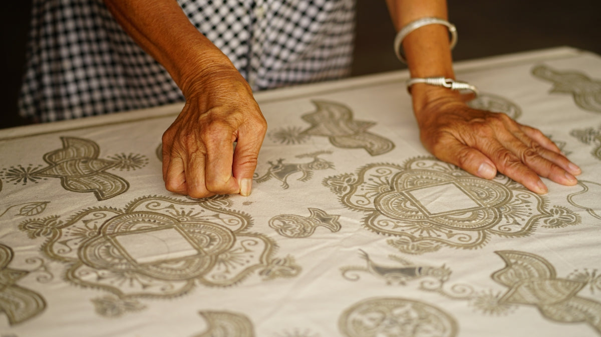 person holding textile