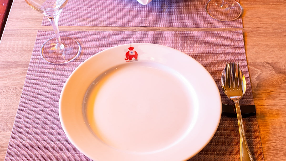 white ceramic plate on table