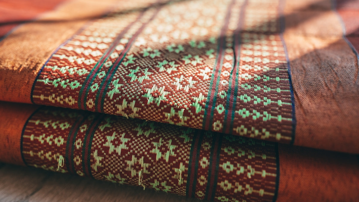 green white and brown textile