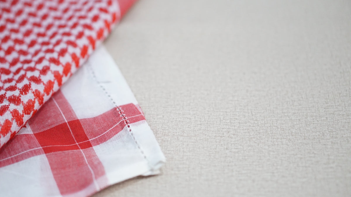 white and red checkered textile