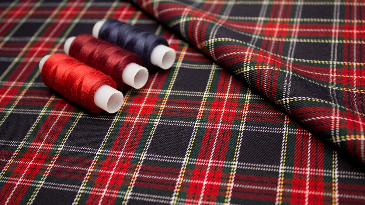 red and white thread on red and white plaid textile