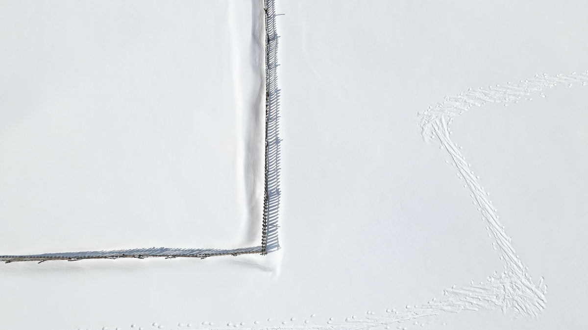 Product image featuring a textured white surface with subtle gray stitching details.