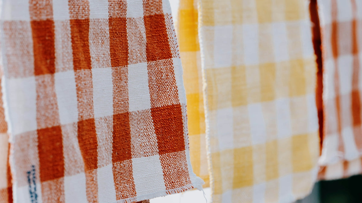 a couple of towels hanging on a clothes line