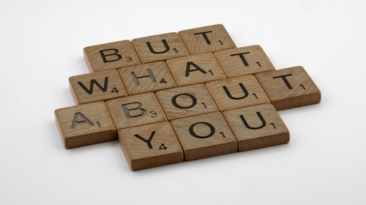 four scrabble tiles spelling out the words but what about you?