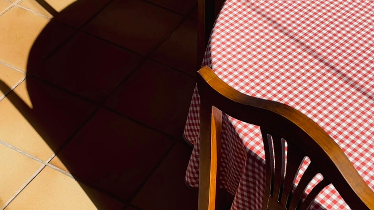 a table with a red and white checkered tablecloth