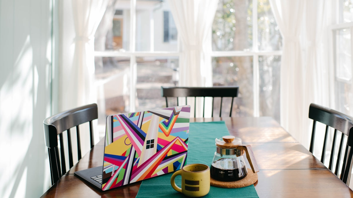 a wooden table topped with a cup of coffee