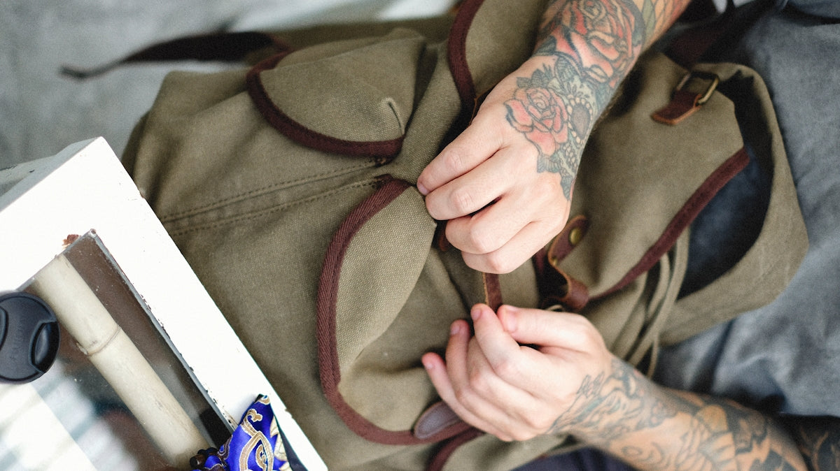 a person with tattoos on their arm