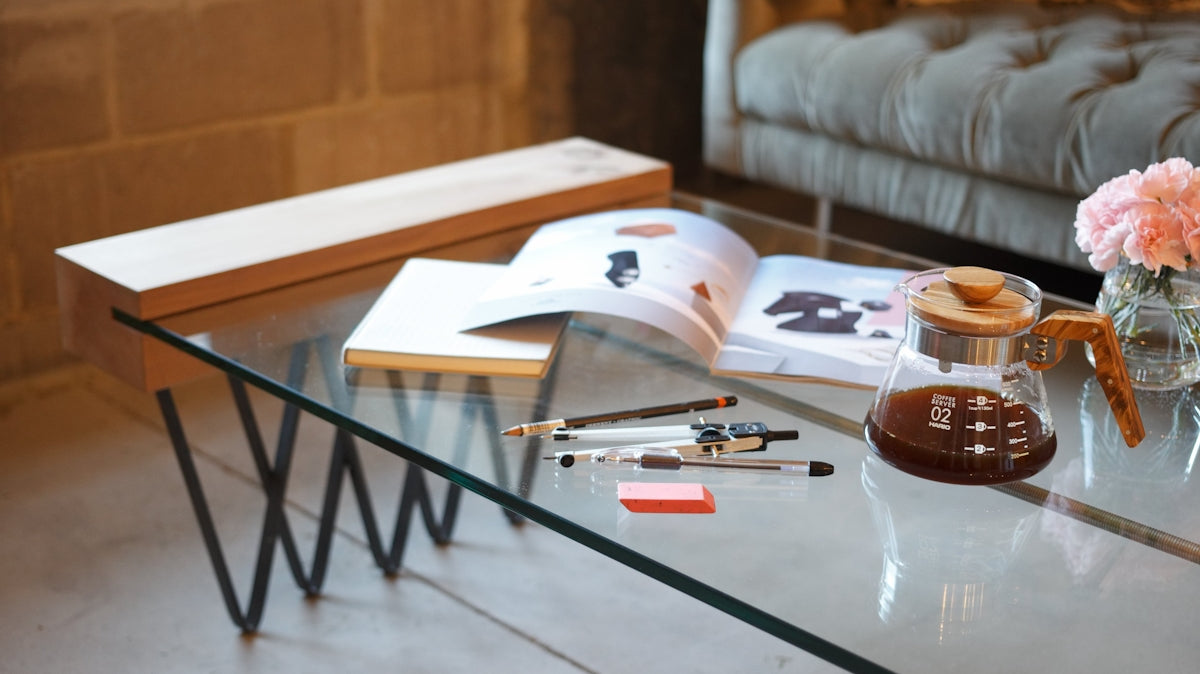 a table with a book and a pen on it