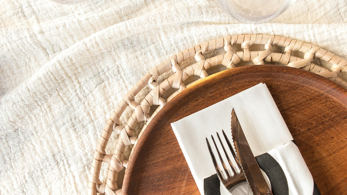 a wooden plate with a fork and knife on it
