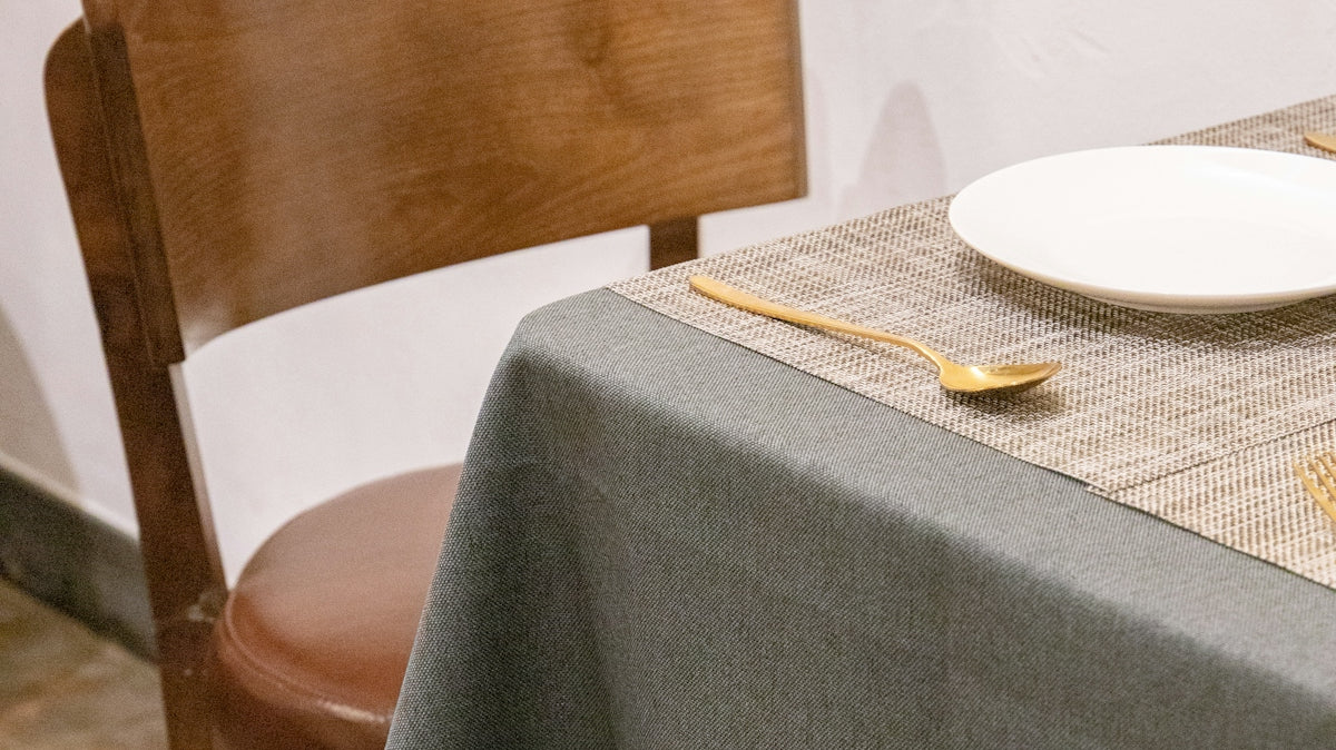 a table with a plate and silverware on it