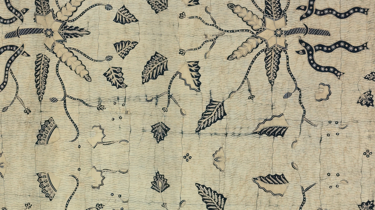 Floral Block Print Fabric featuring intricate black designs on a beige background.