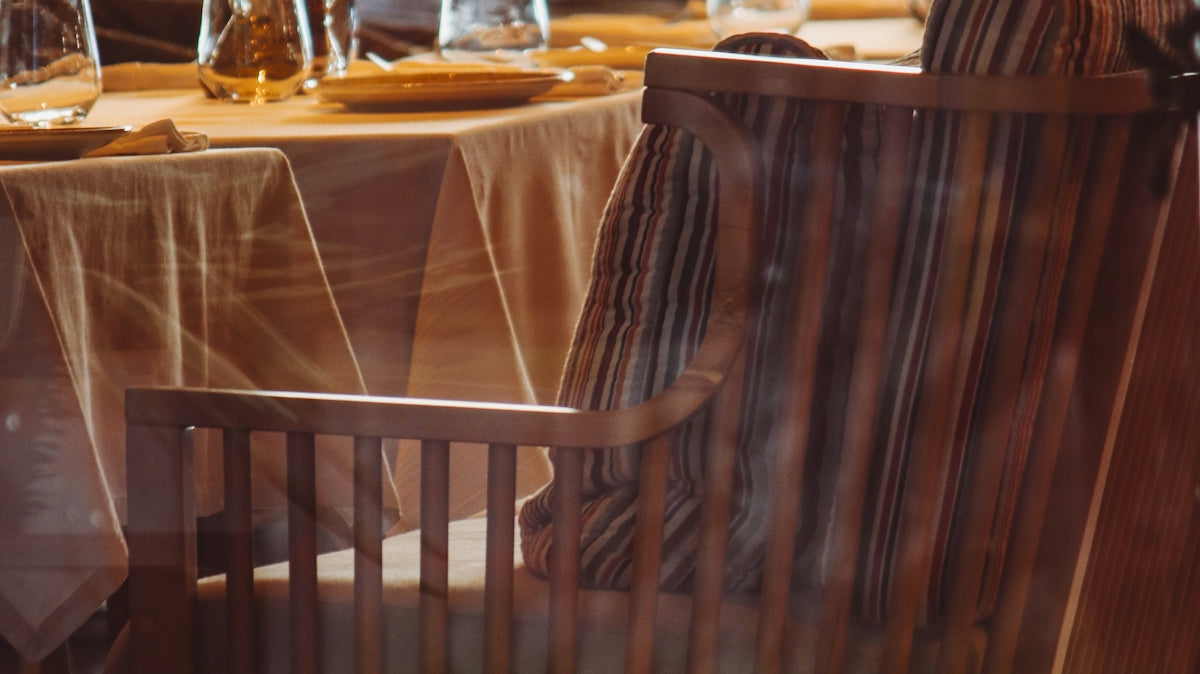 a restaurant with a table and chairs in front of a window