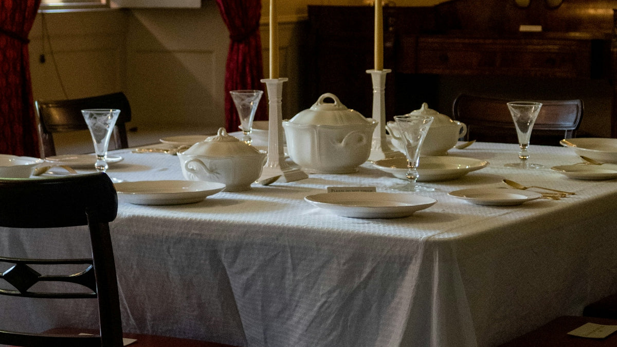 a dining room with a table and chairs