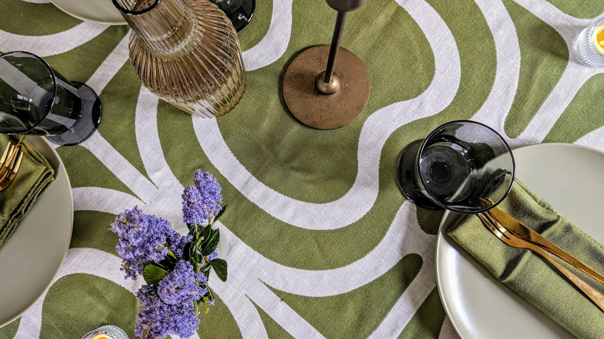 a table topped with plates and glasses on top of a table