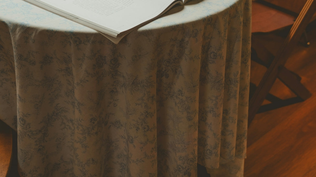 A table with a book and a cup on it