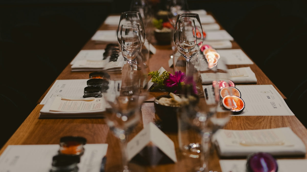 A formal dining table is set elegantly.