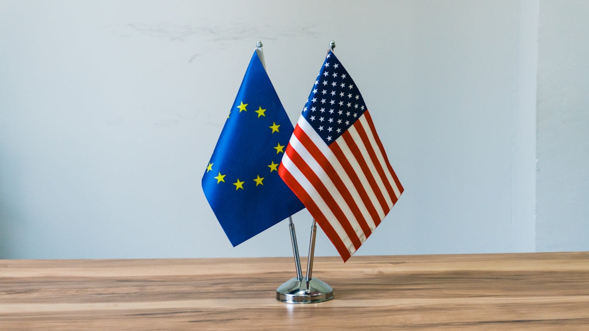 European union and us flags on a table