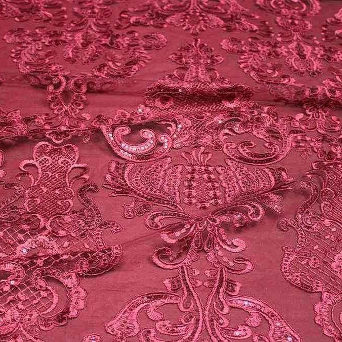 Burgundy Embroidered Fabric featuring intricate patterns and a luxurious sheen.