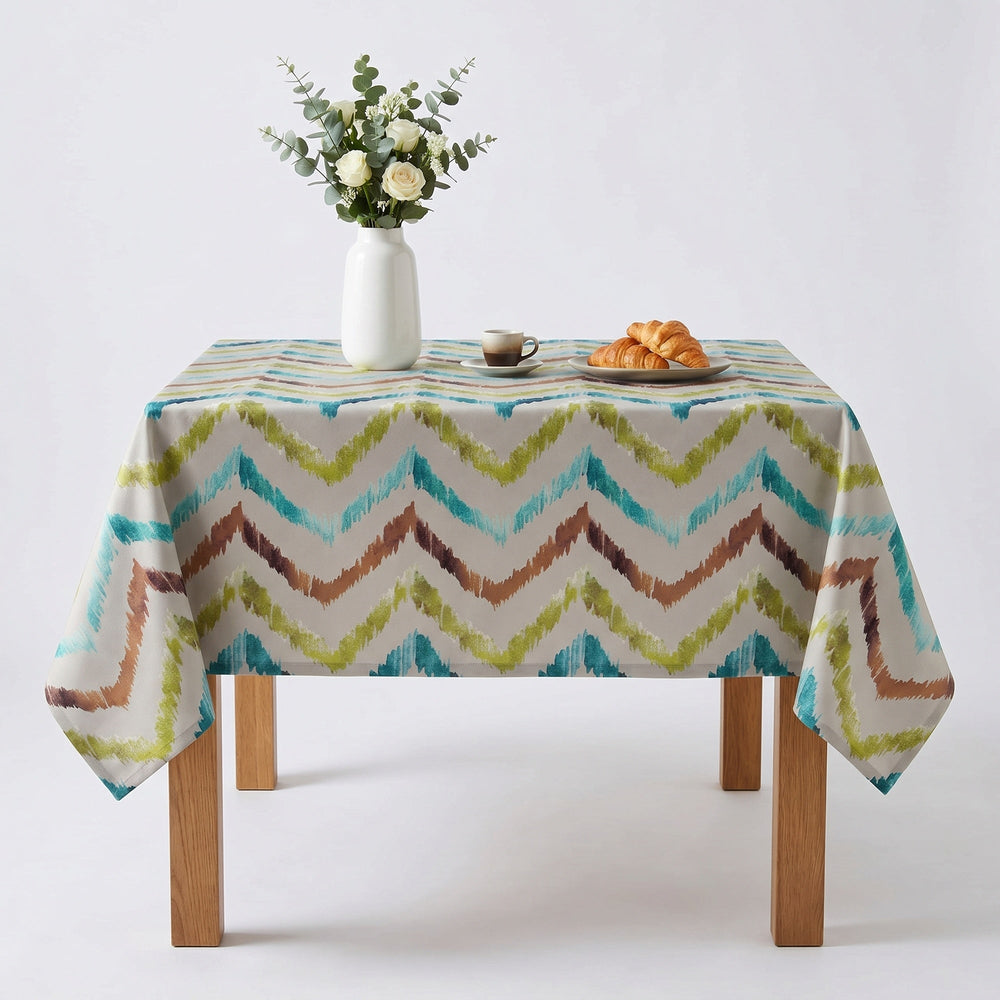 Chevron Pattern Tablecloth in teal and beige colors, enhancing dining decor.