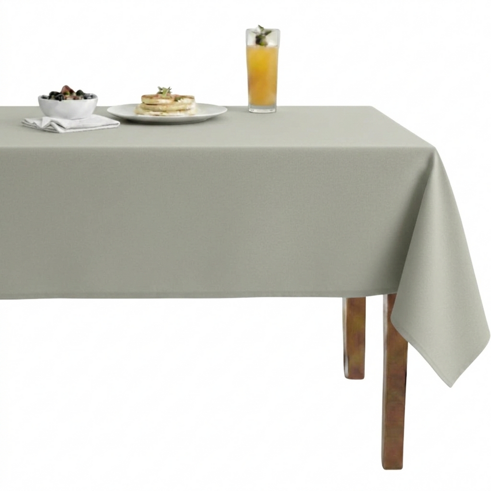 Gray tablecloth enhancing a dining table with food and drinks.