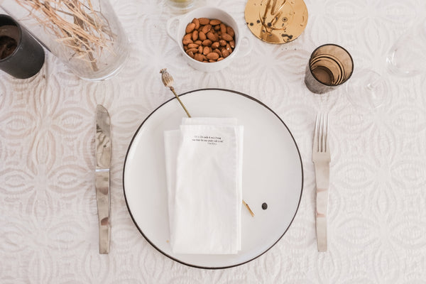 Elegant dinner plate with a white napkin and decorative elements for a stylish dining experience.