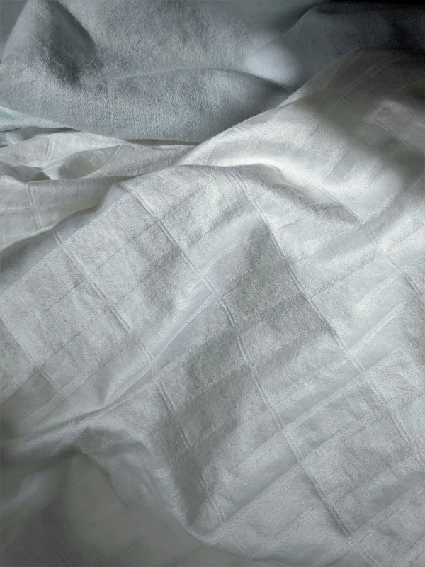 White Linen Fabric with Subtle Texture and Pattern.