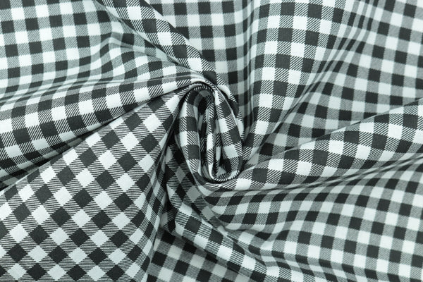 Black and white gingham fabric featuring a classic check pattern.