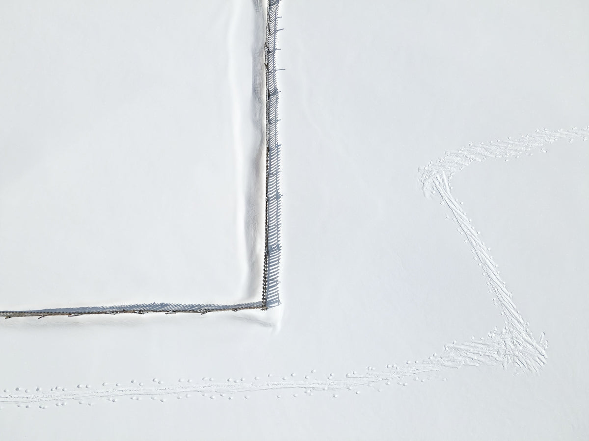 Product image featuring a textured white surface with subtle gray stitching details.