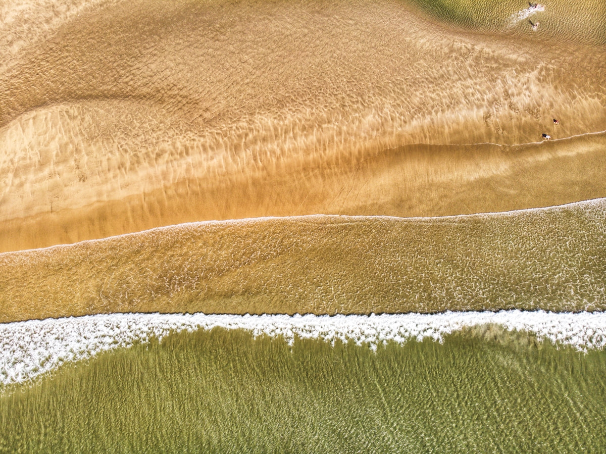 Beach Waves and Sand Patterns showcasing natural textures and colors.