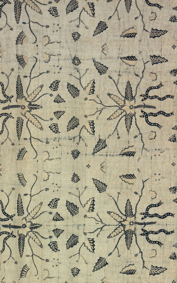 Floral Block Print Fabric featuring intricate black designs on a beige background.