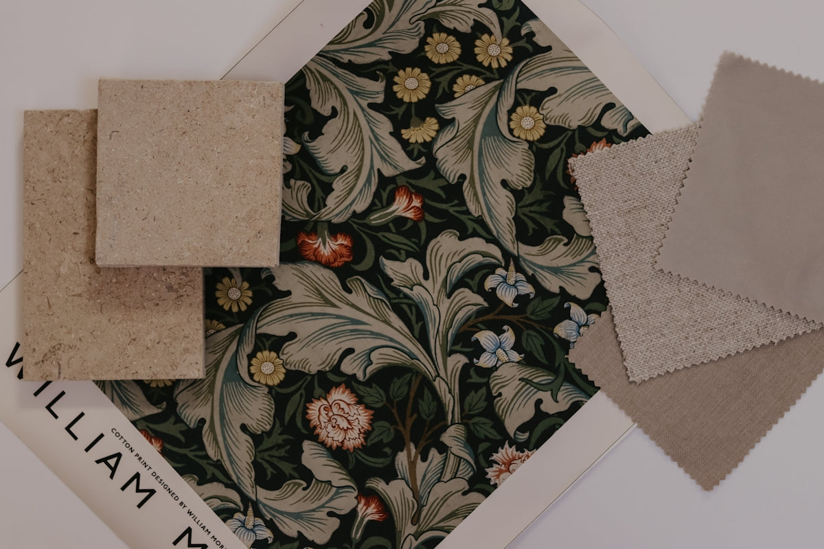 William Morris fabric swatch with floral design and coordinating color samples.