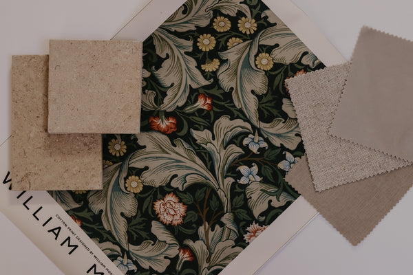 William Morris fabric swatch with floral design and coordinating color samples.
