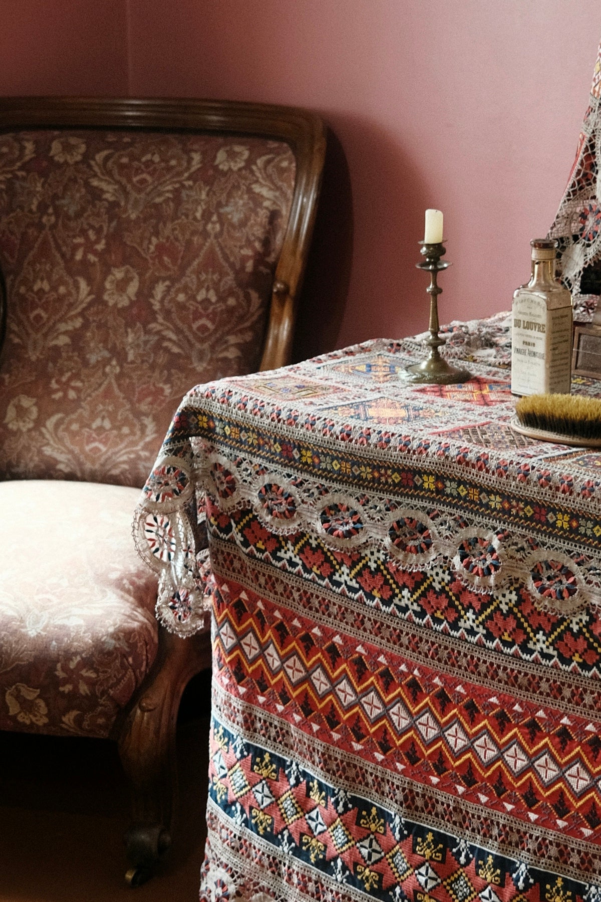 Colorful patterned tablecloth featuring intricate designs, enhancing vintage decor.