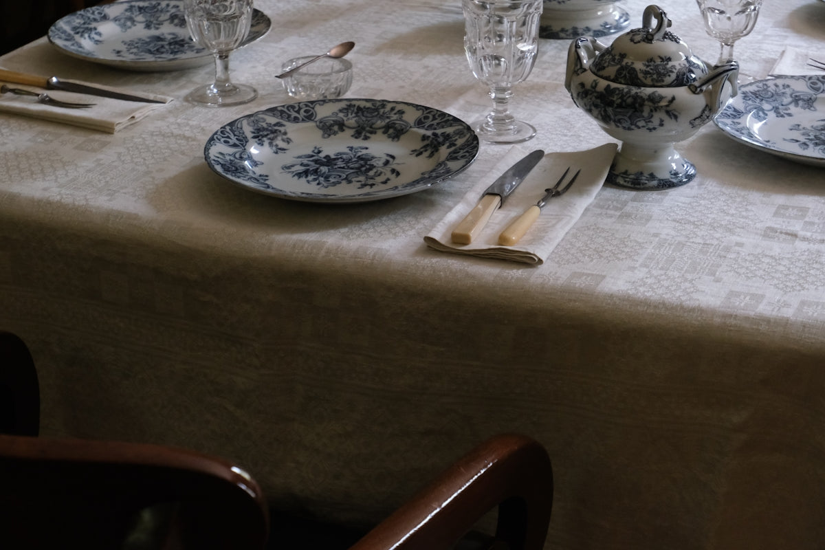 A formal table is set with fine china.