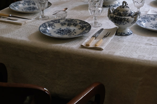 A formal table is set with fine china.
