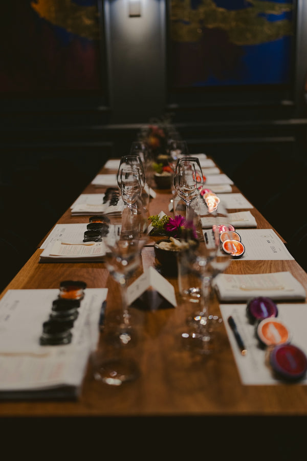 A formal dining table is set elegantly.