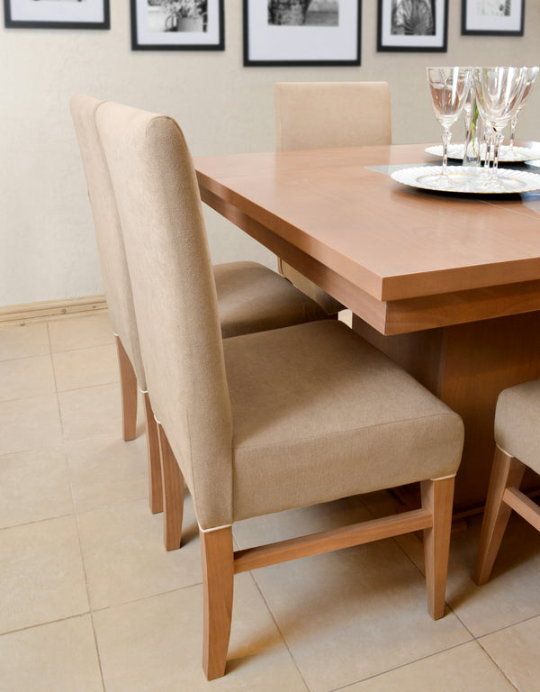 Beige Dining Chairs featuring a modern design, complementing a wooden dining table.