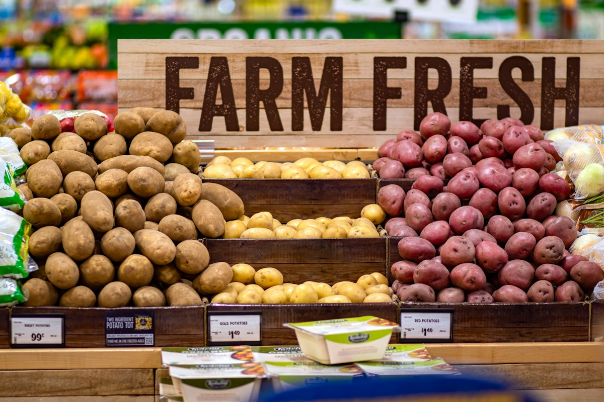 Various farm fresh potatoes displayed in a grocery store
