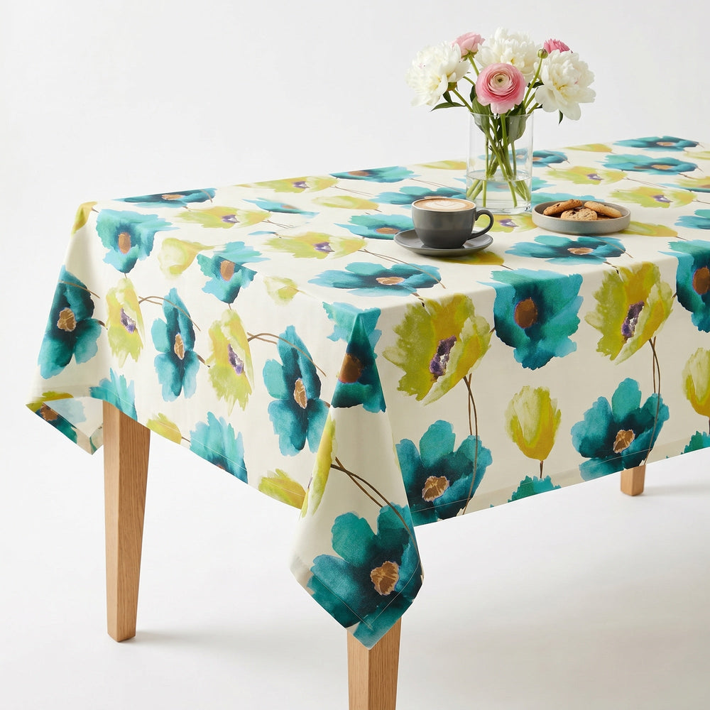 Floral Tablecloth featuring vibrant teal and green flowers on a cream background.