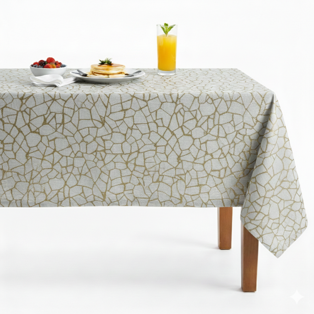 Elegant tablecloth with a gold geometric pattern, perfect for dining occasions.