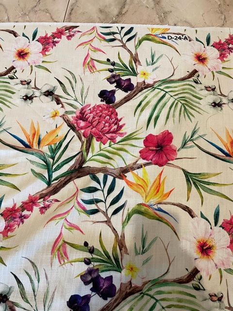 Floral Fabric with vibrant pink and yellow flowers, perfect for crafting and upholstery.