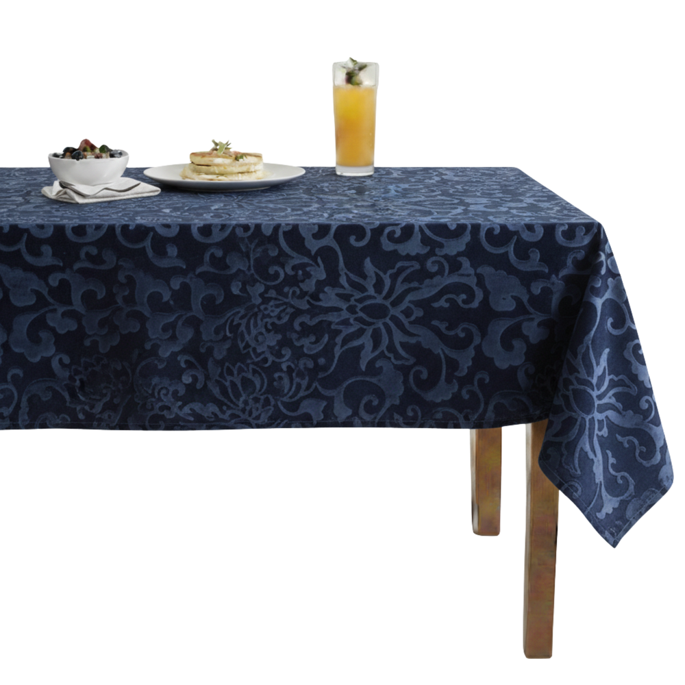Navy floral tablecloth featuring intricate designs, perfect for elegant dining settings.