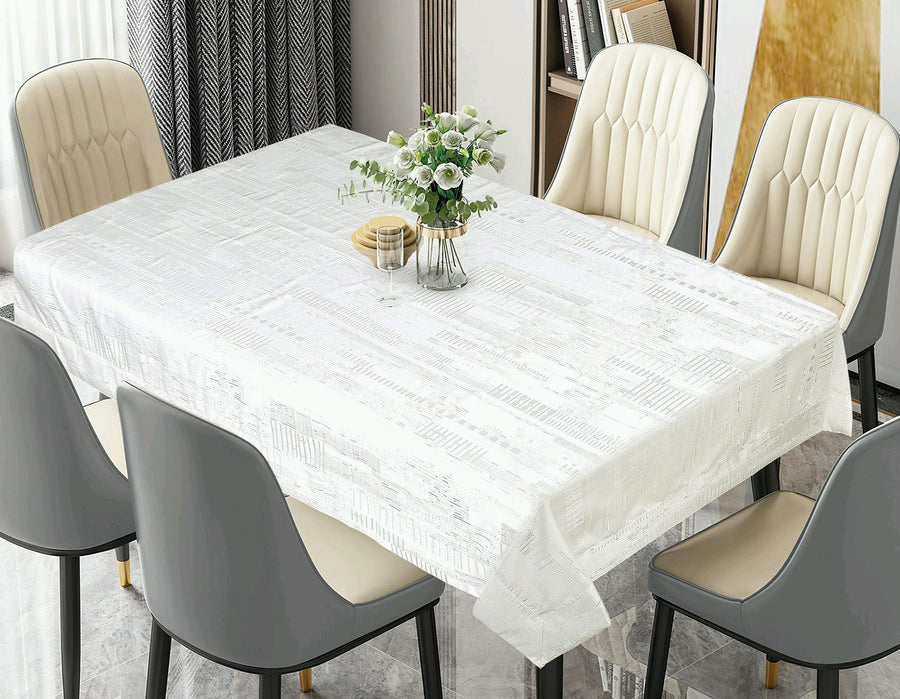 White banquet tablecloth with a subtle tone-on-tone woven texture on a long dining table