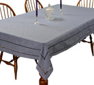 Grey hemstitch tablecloth with an open drawn-thread ladder border on a dining table