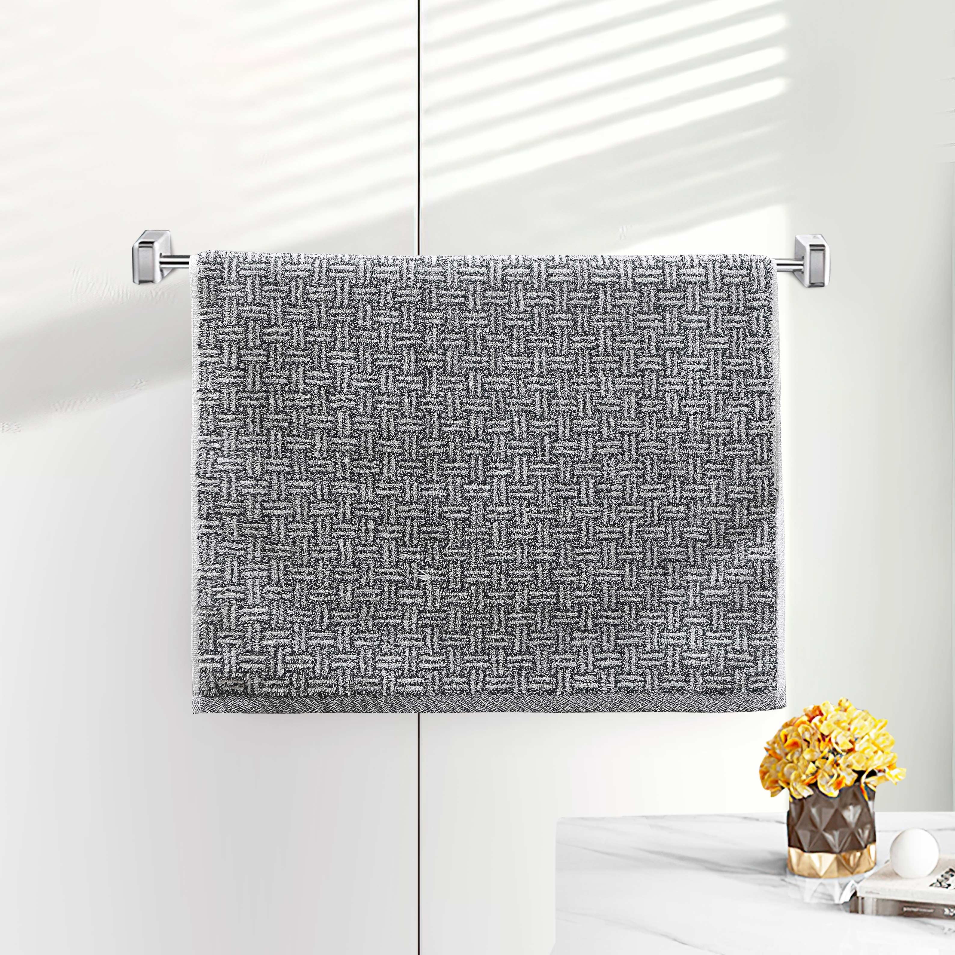 Gray terry hand towel with a woven basketweave dobby texture on a bar