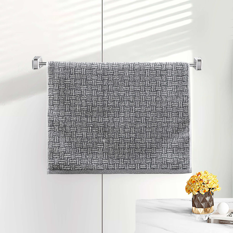 Gray terry hand towel with a woven basketweave dobby texture on a bar