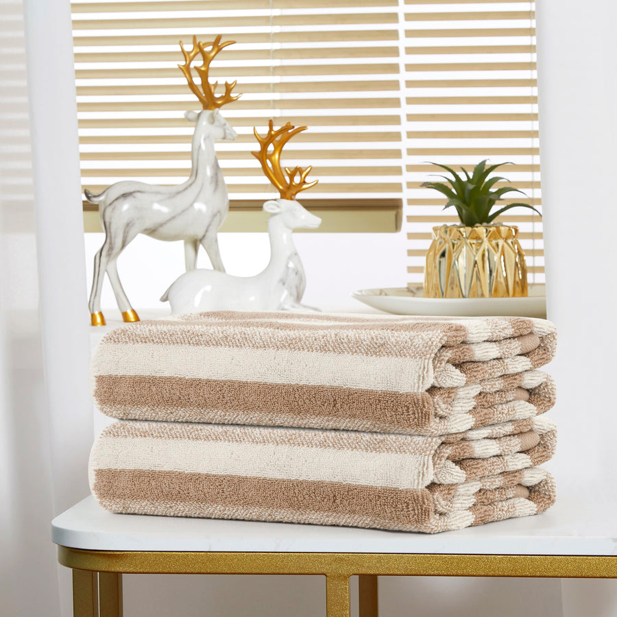 Folded taupe-and-cream striped terry hand towels