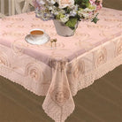 Warm gold tablecloth with woven medallion rosettes and a deep crochet lace border