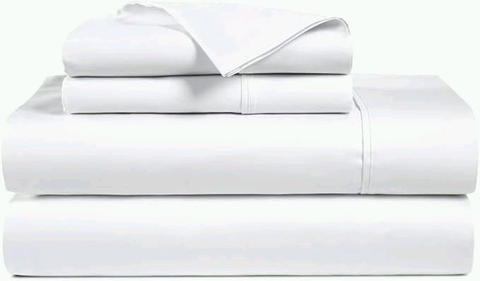 Stack of folded white percale sheets and pillowcases