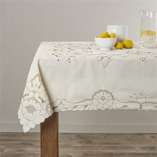 Cream tablecloth with cutwork floral embroidery along the border and corner medallions